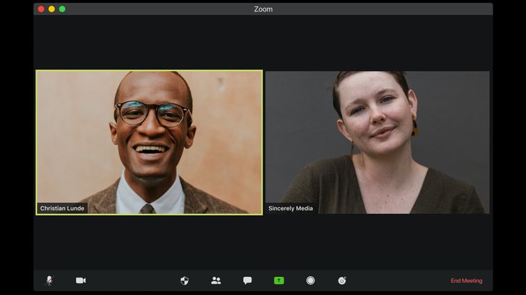 Man and woman on at an online networking event chatting on video