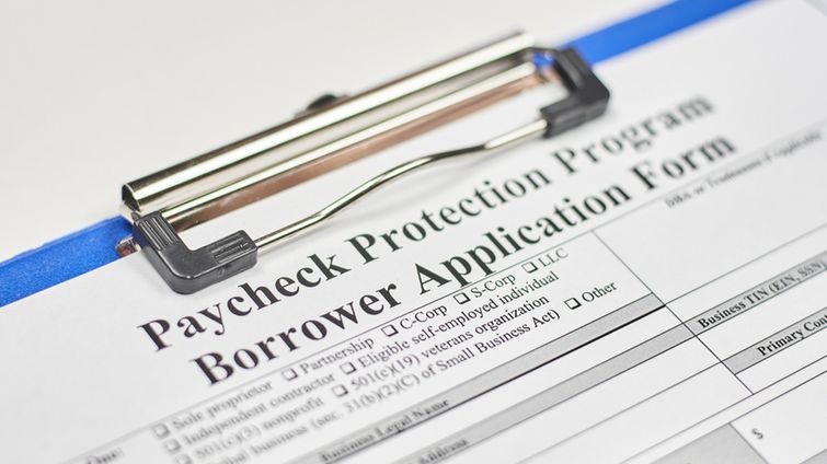 Paycheck Protection Program Borrower Application Form on clipboard