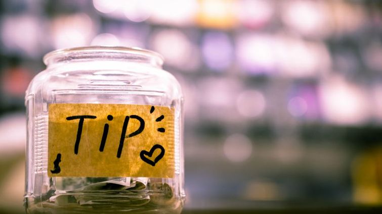 tip jar filled with change showing funding resources for small businesses during coronavirus