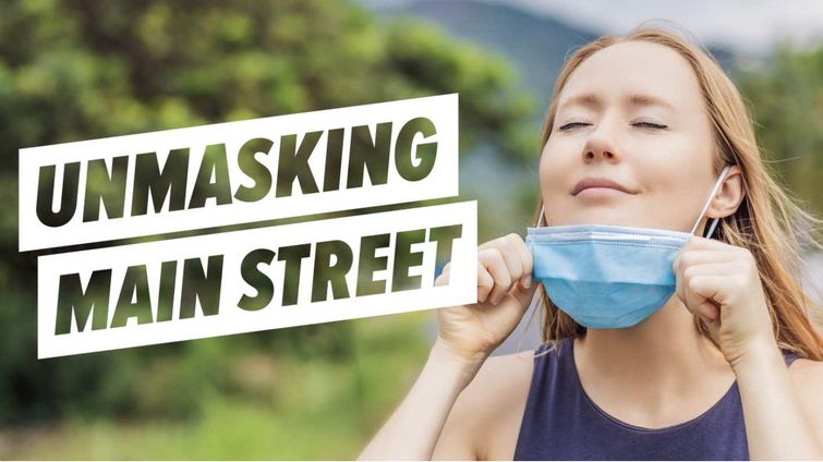 unmasking main street woman taking off mask outdoors