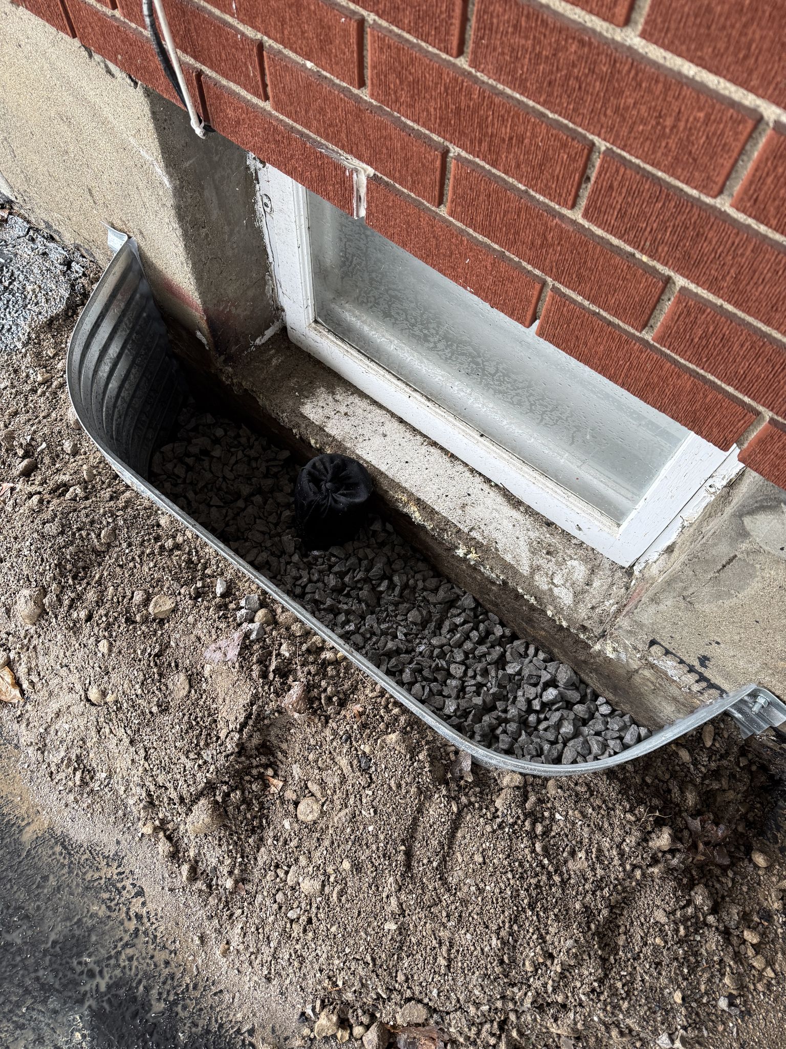 Window well drainage with Mini x waterproofing