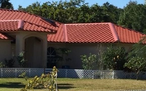 Metal Barrel Tile Roof_Home Value Renovations by Home Value Renovations