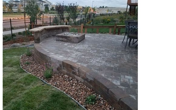 Raised Paver Patio With Firepit And Custom Seating By New Vision