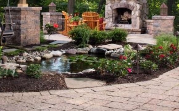 Paver patio, walkways, fireplaces, firepits, water features by Gold Standard Landscaping