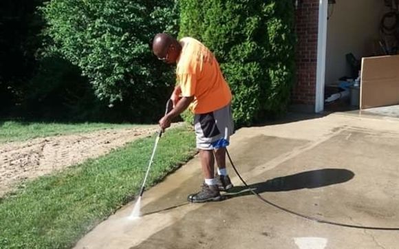 Tony is pressure washing  by Teresa & Tony Crews Enterprises LLC dba Maid EZ Cleaning