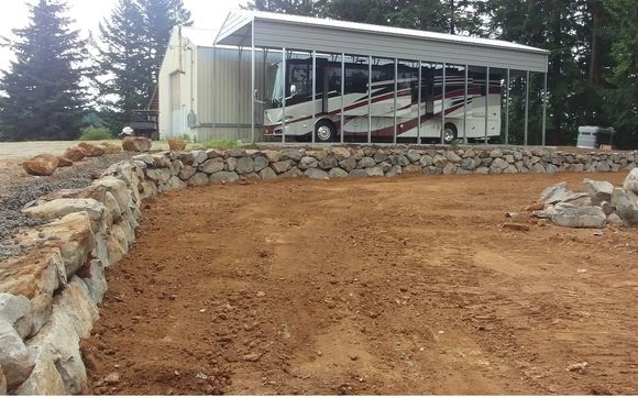 Boulder walls by Tier 1 Excavating Llc