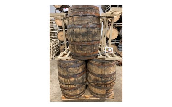 Used wine/whiskey barrels and barrel racks by The Barrel Broker