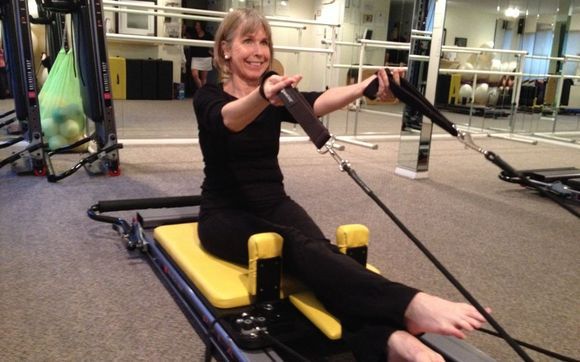 Student working on a Pilates Reformer  by STUDIO 1 Pilates n Movement, LLC