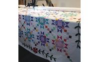 Longarm Quilting services and commissioned quilts  by Fluff and Ruffles Quilting Services