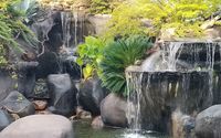 Water gardens with minigolf by THE OASIS RANCH MINI GOLF