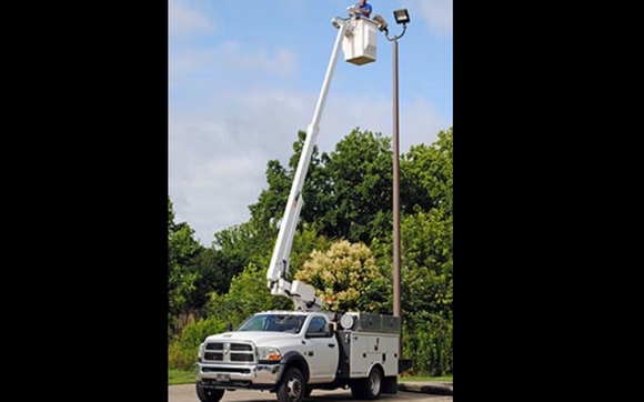 Bucket truck site pole lights & sign service by PDQ Electric Corp