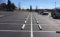 Concrete Wheel Stops by STRIPES Parking Lot Service, Inc.
