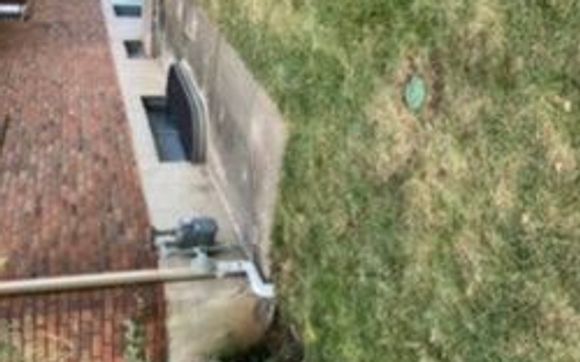 Buried downspout extensions  by Davenport Foundation Repair