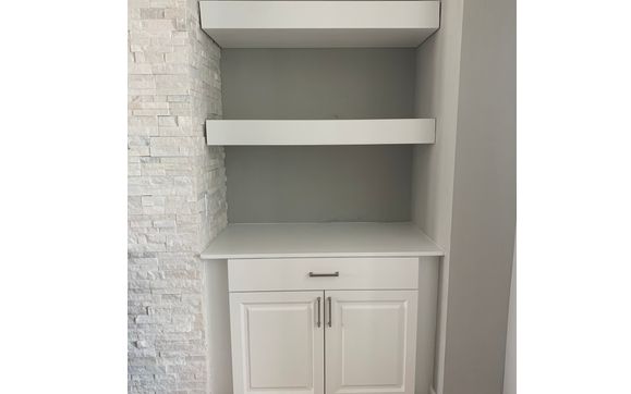 Custom cabinets and floating shelves. by Charles West Handyman LLC.