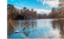 use of clean swimmable lake, canoe, stand up paddleboard, firepits by The Carriage House along Andrews Lake