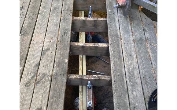 Lift Brackets under an existing deck  by Innovative Pier Solutions