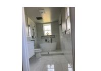 Beautiful and modern with free standing tub master bathroom  by FLX construction llc