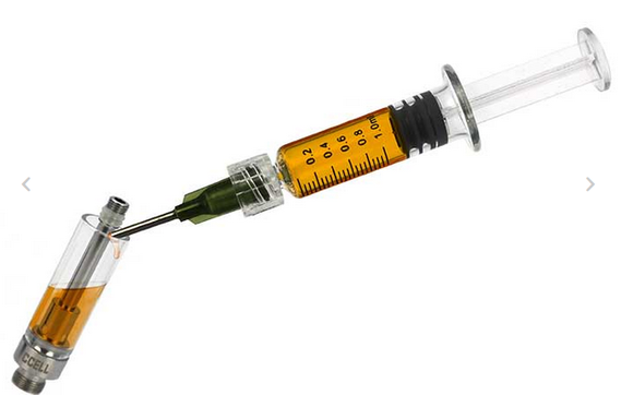 Filling a vape cart with our own solvent free heat cured rosin oil by Dreamland Gardens