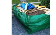 Green bag pickup by Curbside Junk Removal, LLC