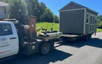 Shed building relocation services by Mountain movers transport