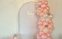Balloon garland and arch backdrop by Haley Station Wedding and Event Venue