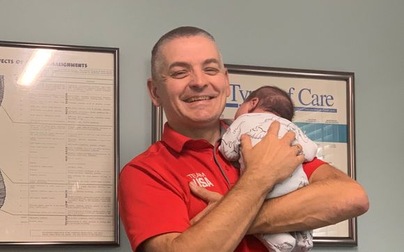 Dr BJ Treating Patients  by West Michigan Chiropractic & Sports, LLC