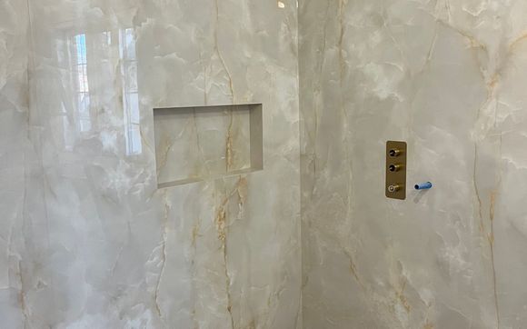 Tiling the shower by AH Tile Installation 