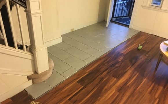 Hardwood installation along with tile too go along with it.  by J.M.H. Contracting LLC “A Square Above The Rest”