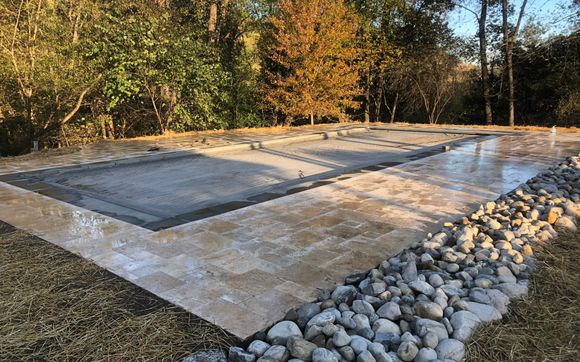 Swimming pool construction amd Travertine patio by Northern Virginia Hemp and Agriculture