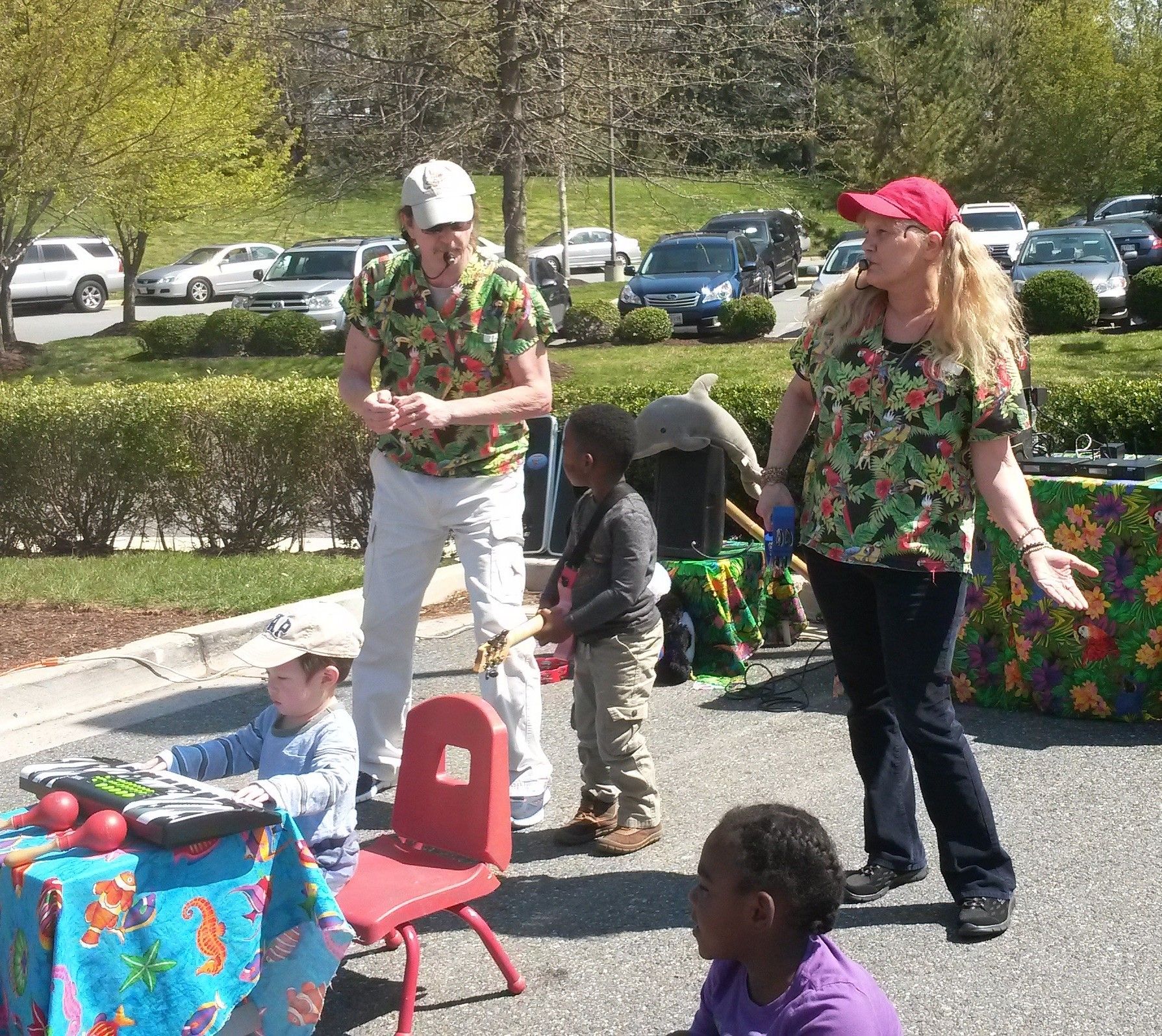 Cody and Bj business owners on stage outside performing live music