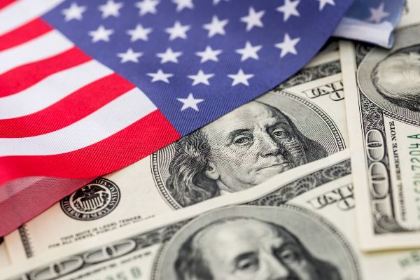 american flag and hundred dollar bills