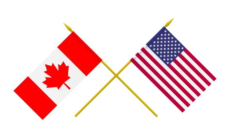 US and Canadian flags crossed