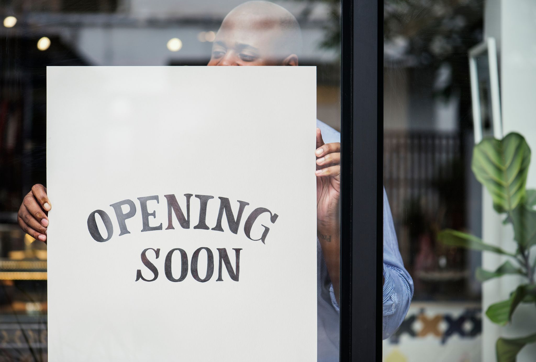 opening soon sign on storefront window