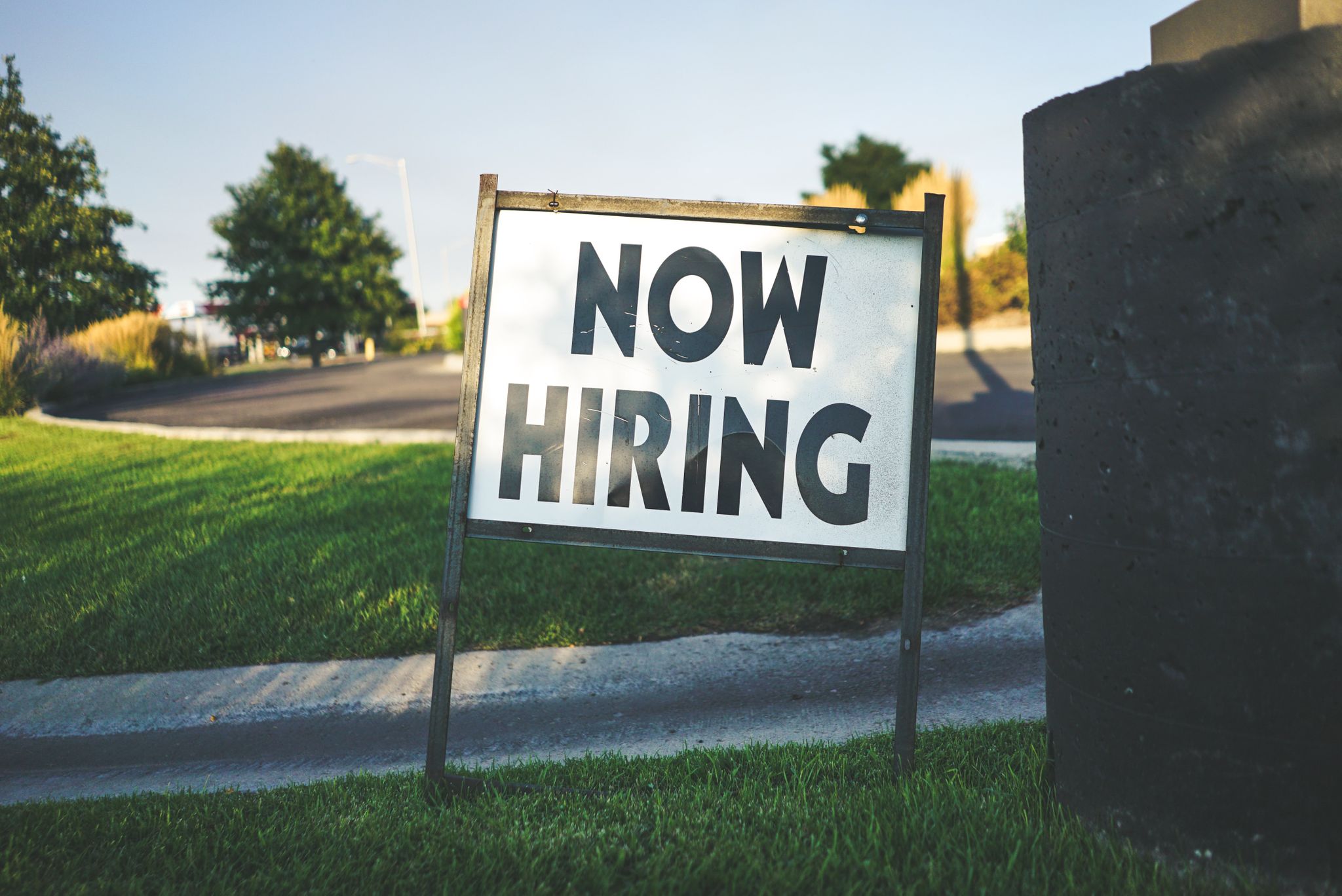 now hiring sign on grass small business employee concerns