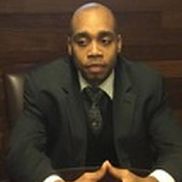 Kenne Dinham Jr from The  Solid Stone Group